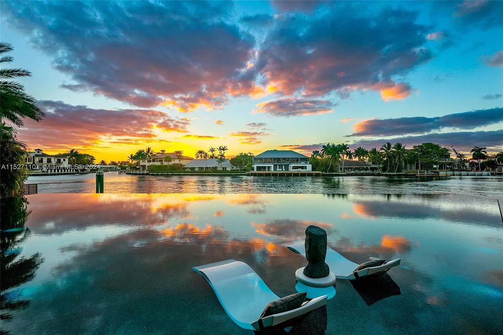 Experience unparalleled luxury in this custom-built masterpiece. 5 beds, 4.5 baths, $500k infinity pool, Gaggenau kitchen, Crestron smart home, private beach access. Unwind by the sunken firepit or boat directly from your Intracoastal oasis. Live the dream in Sea Ranch Lakes!