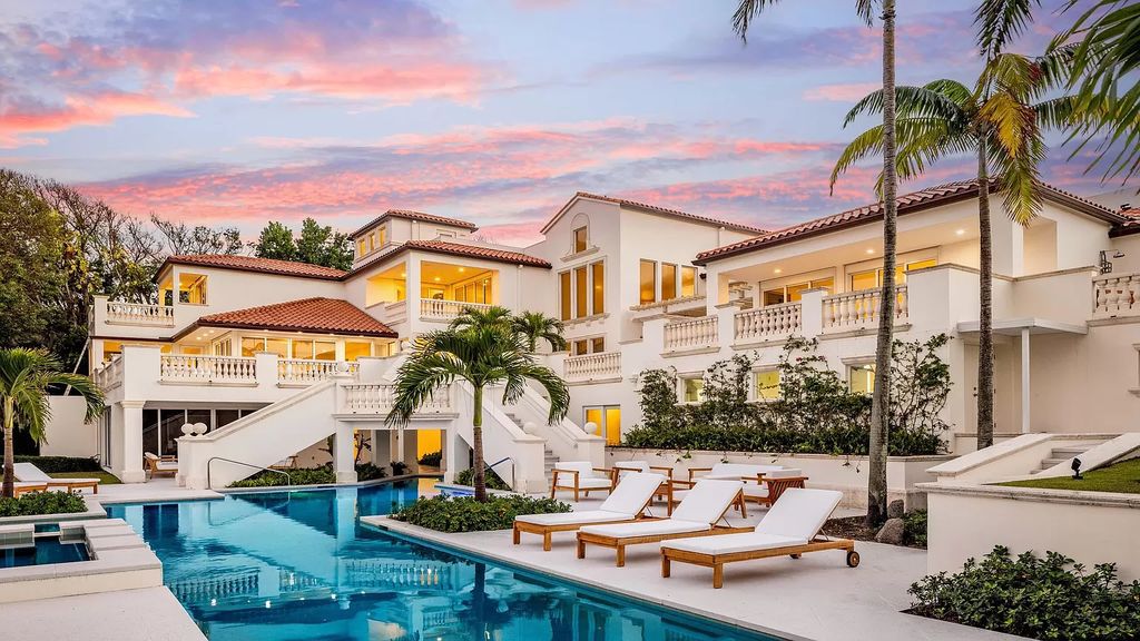 This opulent 8-bedroom estate boasts 150 feet of ocean and Intracoastal frontage, private beach house, resort-style pool, & stunning updates. Enjoy water views, private dock and manicured grounds in exclusive Manalapan.