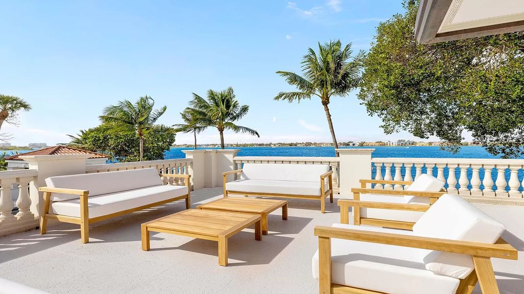 This opulent 8-bedroom estate boasts 150 feet of ocean and Intracoastal frontage, private beach house, resort-style pool, & stunning updates. Enjoy water views, private dock and manicured grounds in exclusive Manalapan.