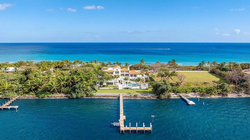 This opulent 8-bedroom estate boasts 150 feet of ocean and Intracoastal frontage, private beach house, resort-style pool, & stunning updates. Enjoy water views, private dock and manicured grounds in exclusive Manalapan.