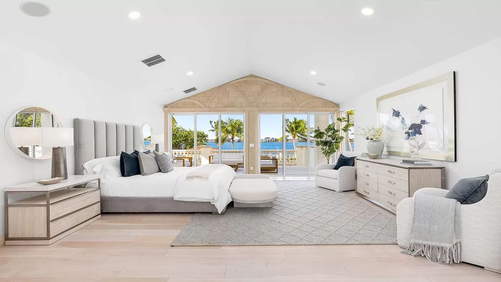 This opulent 8-bedroom estate boasts 150 feet of ocean and Intracoastal frontage, private beach house, resort-style pool, & stunning updates. Enjoy water views, private dock and manicured grounds in exclusive Manalapan.