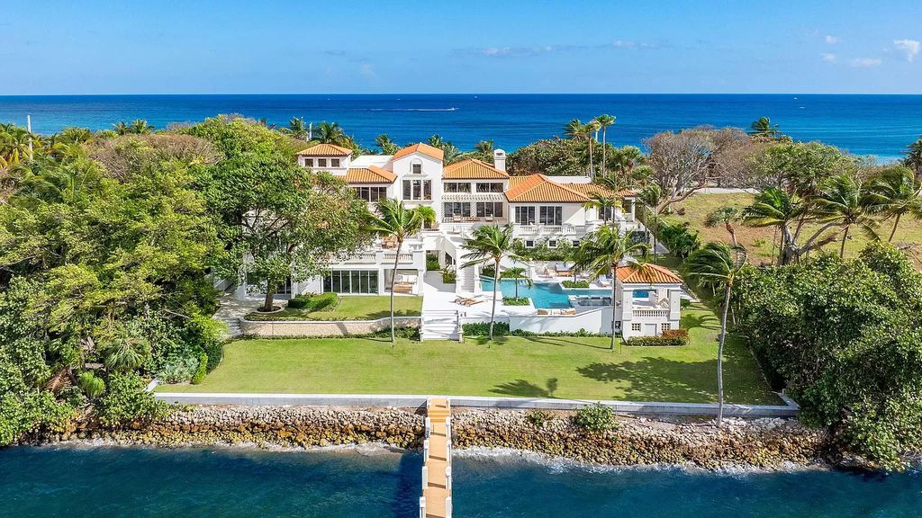 This opulent 8-bedroom estate boasts 150 feet of ocean and Intracoastal frontage, private beach house, resort-style pool, & stunning updates. Enjoy water views, private dock and manicured grounds in exclusive Manalapan.