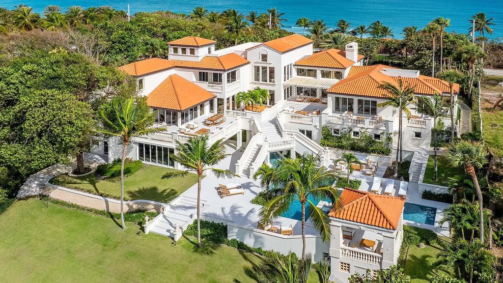 This opulent 8-bedroom estate boasts 150 feet of ocean and Intracoastal frontage, private beach house, resort-style pool, & stunning updates. Enjoy water views, private dock and manicured grounds in exclusive Manalapan.