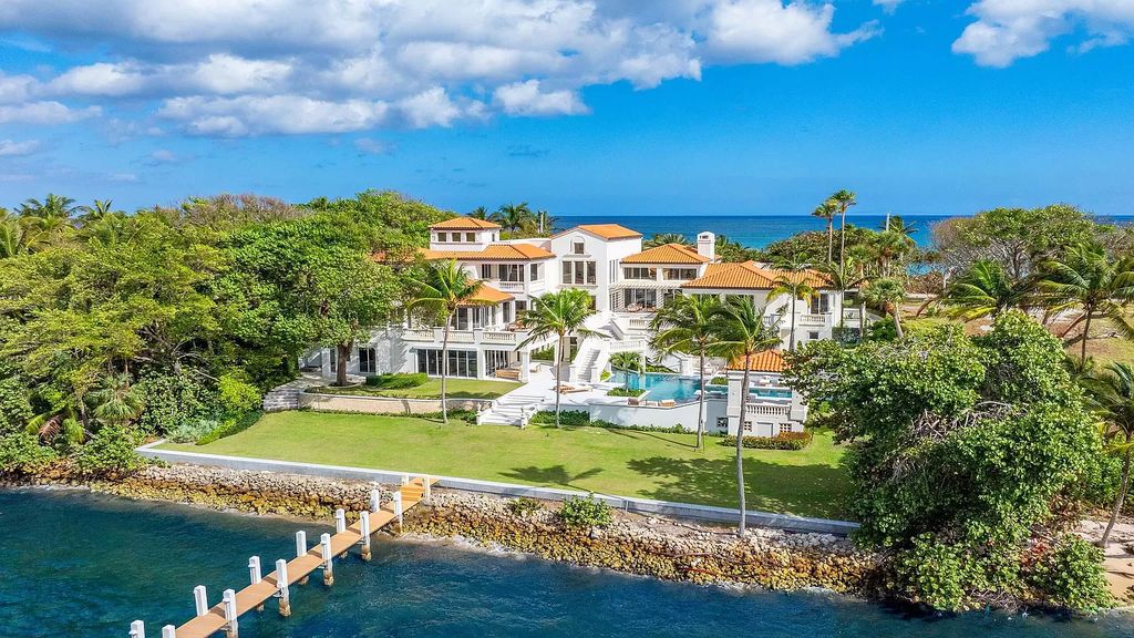 This opulent 8-bedroom estate boasts 150 feet of ocean and Intracoastal frontage, private beach house, resort-style pool, & stunning updates. Enjoy water views, private dock and manicured grounds in exclusive Manalapan.