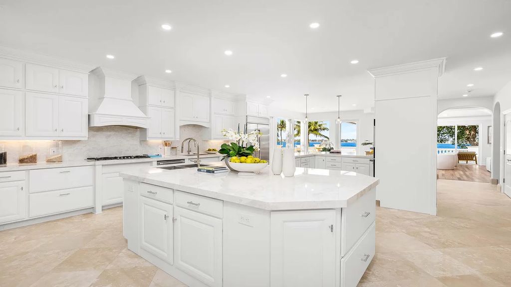 This opulent 8-bedroom estate boasts 150 feet of ocean and Intracoastal frontage, private beach house, resort-style pool, & stunning updates. Enjoy water views, private dock and manicured grounds in exclusive Manalapan.