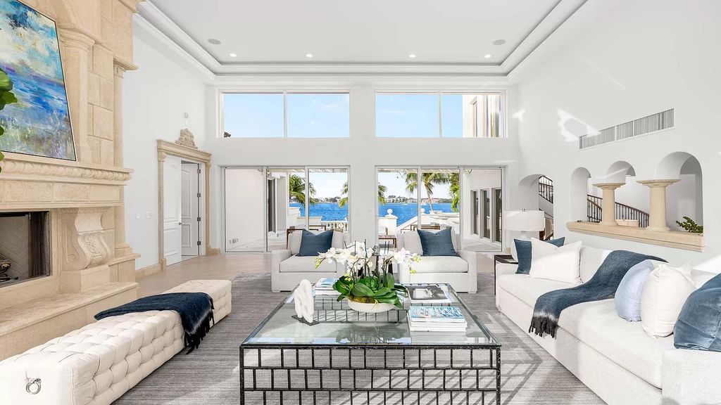 This opulent 8-bedroom estate boasts 150 feet of ocean and Intracoastal frontage, private beach house, resort-style pool, & stunning updates. Enjoy water views, private dock and manicured grounds in exclusive Manalapan.