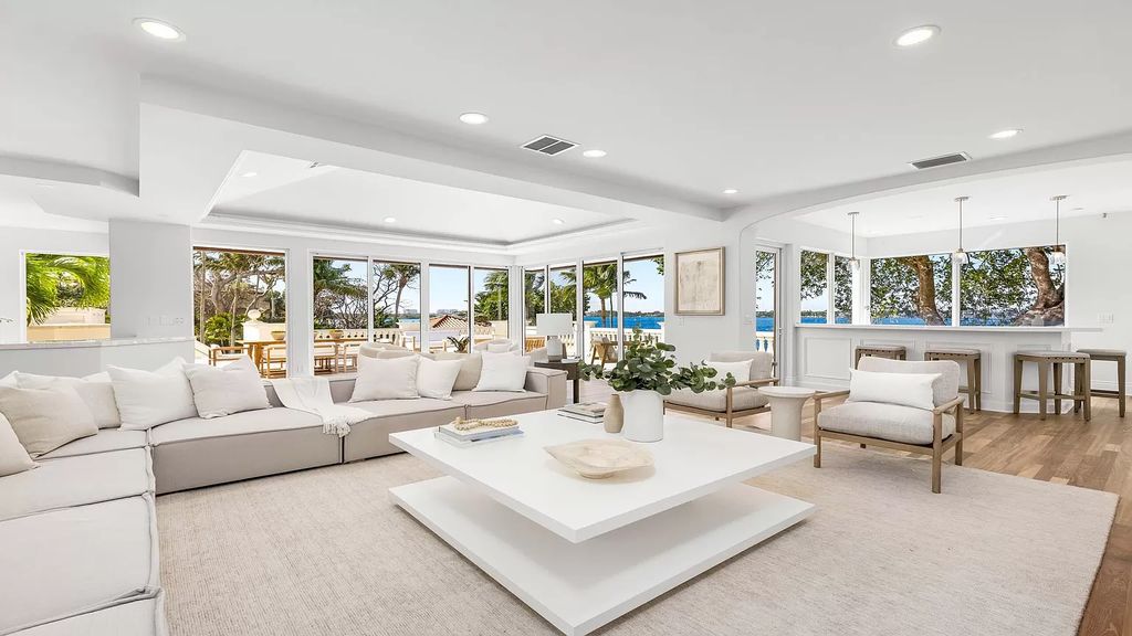 This opulent 8-bedroom estate boasts 150 feet of ocean and Intracoastal frontage, private beach house, resort-style pool, & stunning updates. Enjoy water views, private dock and manicured grounds in exclusive Manalapan.