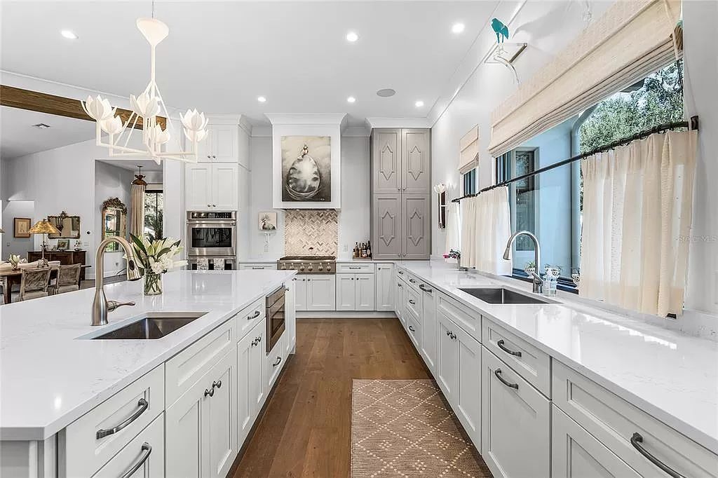 This stunning 2020 Alys-Rosemary Beach-style home boasts designer finishes, seamless indoor-outdoor flow, & a private pool oasis.