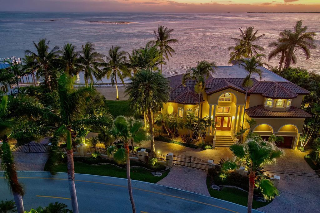 This custom estate in Key Colony Beach boasts breathtaking ocean views, a private beach, infinity pool, home theater, elevator and 4-car garage. Included: an additional lot with a 62' dock! Don't miss this rare find!