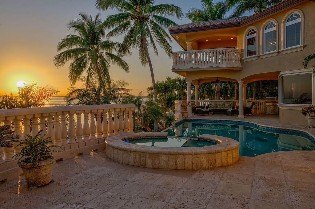 This custom estate in Key Colony Beach boasts breathtaking ocean views, a private beach, infinity pool, home theater, elevator and 4-car garage. Included: an additional lot with a 62' dock! Don't miss this rare find!