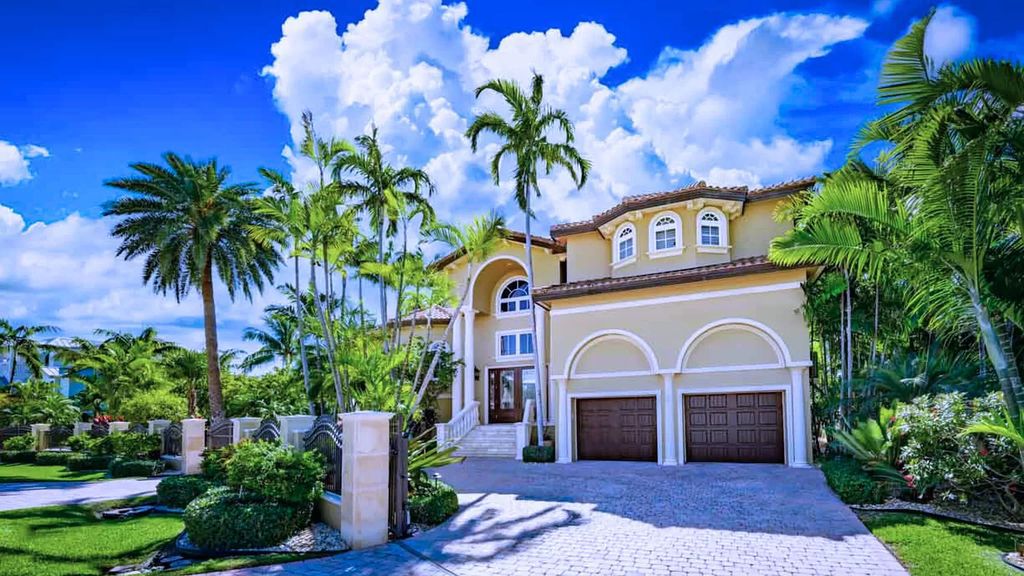 This custom estate in Key Colony Beach boasts breathtaking ocean views, a private beach, infinity pool, home theater, elevator and 4-car garage. Included: an additional lot with a 62' dock! Don't miss this rare find!