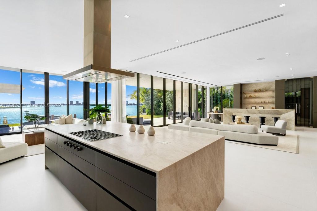 Brand-new Bay Harbor Islands masterpiece with 80 feet waterfront, sunsets, pool, spa and gourmet kitchen. Designed for entertaining by SDH Studio.