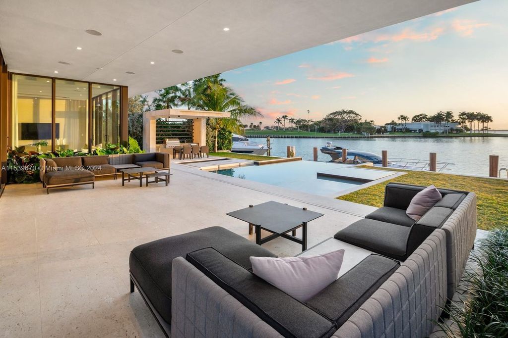 Brand-new Bay Harbor Islands masterpiece with 80 feet waterfront, sunsets, pool, spa and gourmet kitchen. Designed for entertaining by SDH Studio.