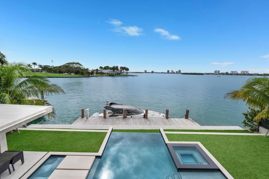 Brand-new Bay Harbor Islands masterpiece with 80 feet waterfront, sunsets, pool, spa and gourmet kitchen. Designed for entertaining by SDH Studio.