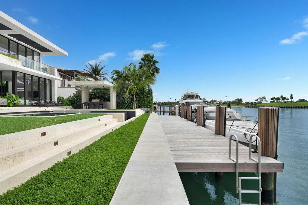 Brand-new Bay Harbor Islands masterpiece with 80 feet waterfront, sunsets, pool, spa and gourmet kitchen. Designed for entertaining by SDH Studio.