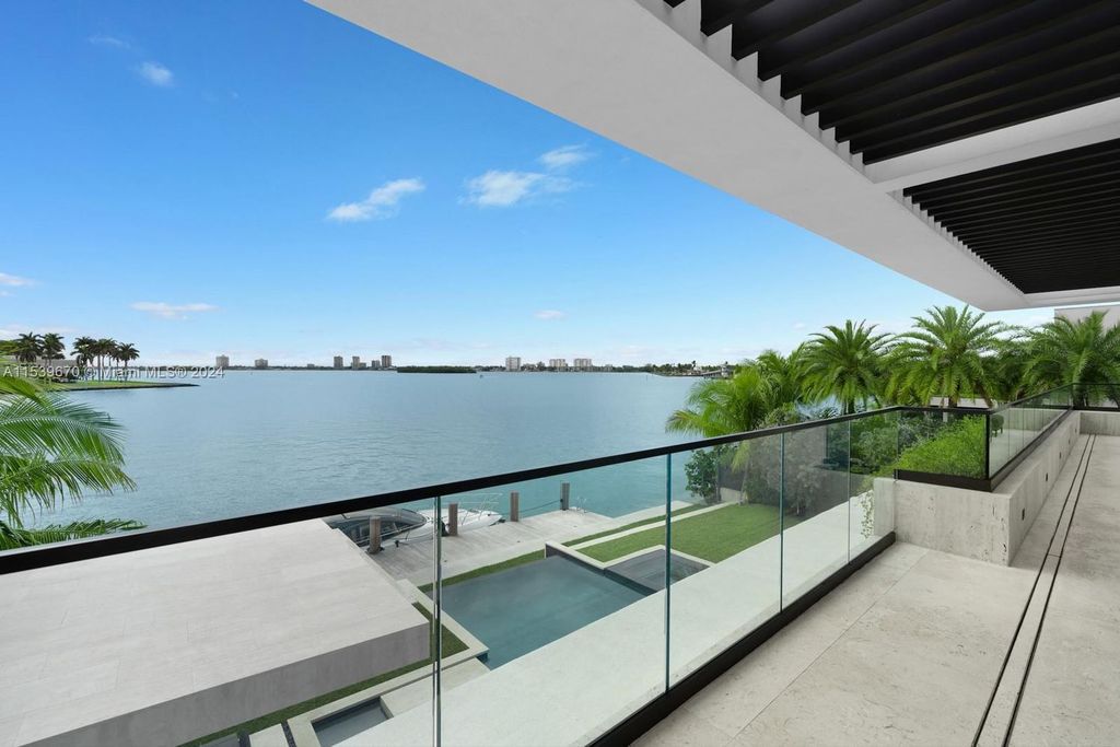 Brand-new Bay Harbor Islands masterpiece with 80 feet waterfront, sunsets, pool, spa and gourmet kitchen. Designed for entertaining by SDH Studio.