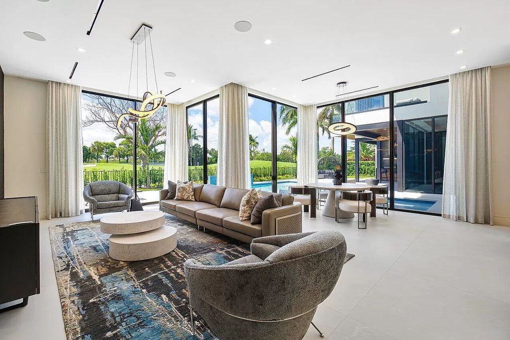 Featuring a gourmet kitchen, infinity pool, resort-style entertaining area, and stunning golf course views, this designer-furnished masterpiece offers unparalleled living.