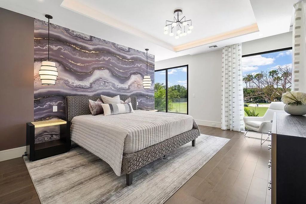 Featuring a gourmet kitchen, infinity pool, resort-style entertaining area, and stunning golf course views, this designer-furnished masterpiece offers unparalleled living.