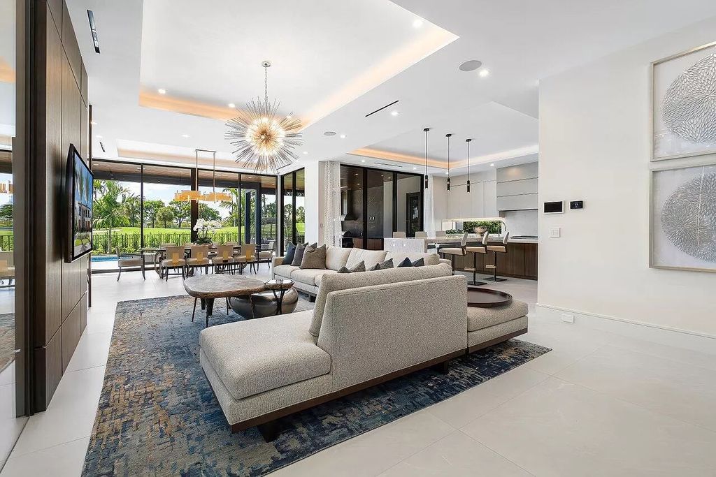 Featuring a gourmet kitchen, infinity pool, resort-style entertaining area, and stunning golf course views, this designer-furnished masterpiece offers unparalleled living.