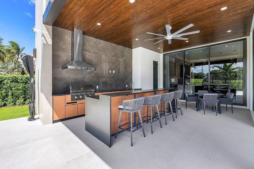 Featuring a gourmet kitchen, infinity pool, resort-style entertaining area, and stunning golf course views, this designer-furnished masterpiece offers unparalleled living.