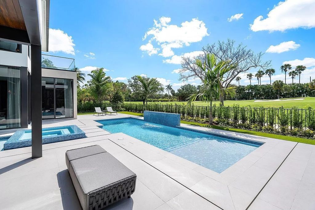 Featuring a gourmet kitchen, infinity pool, resort-style entertaining area, and stunning golf course views, this designer-furnished masterpiece offers unparalleled living.