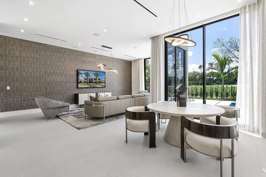 Featuring a gourmet kitchen, infinity pool, resort-style entertaining area, and stunning golf course views, this designer-furnished masterpiece offers unparalleled living.