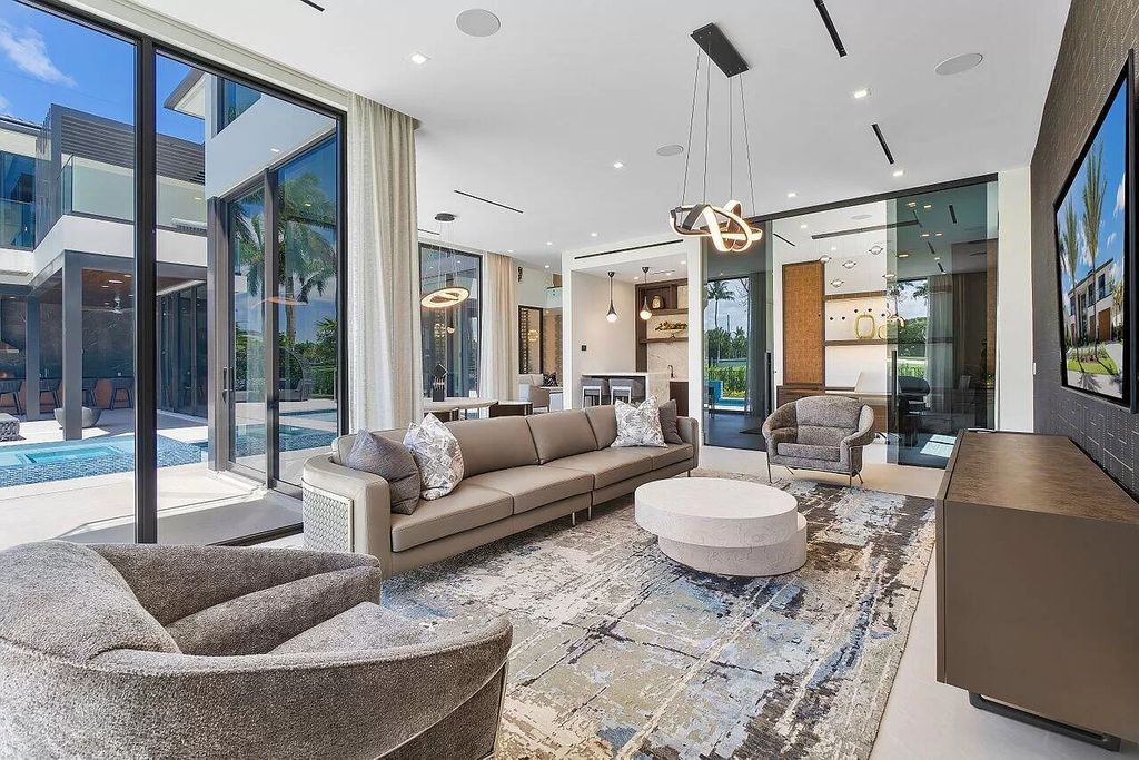 Featuring a gourmet kitchen, infinity pool, resort-style entertaining area, and stunning golf course views, this designer-furnished masterpiece offers unparalleled living.