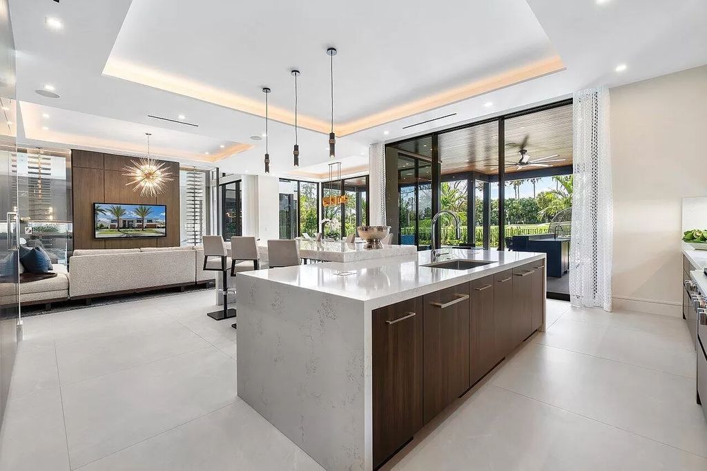 Featuring a gourmet kitchen, infinity pool, resort-style entertaining area, and stunning golf course views, this designer-furnished masterpiece offers unparalleled living.