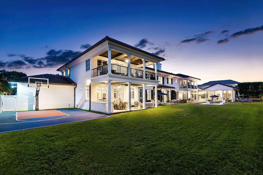 Live the epitome of luxury living in this 5-bedroom masterpiece by Tuthill Architecture in Boca Raton. Featuring a designer interior, pool, basketball court, putting green, casita, this estate offers the perfect blend of elegance and functionality.