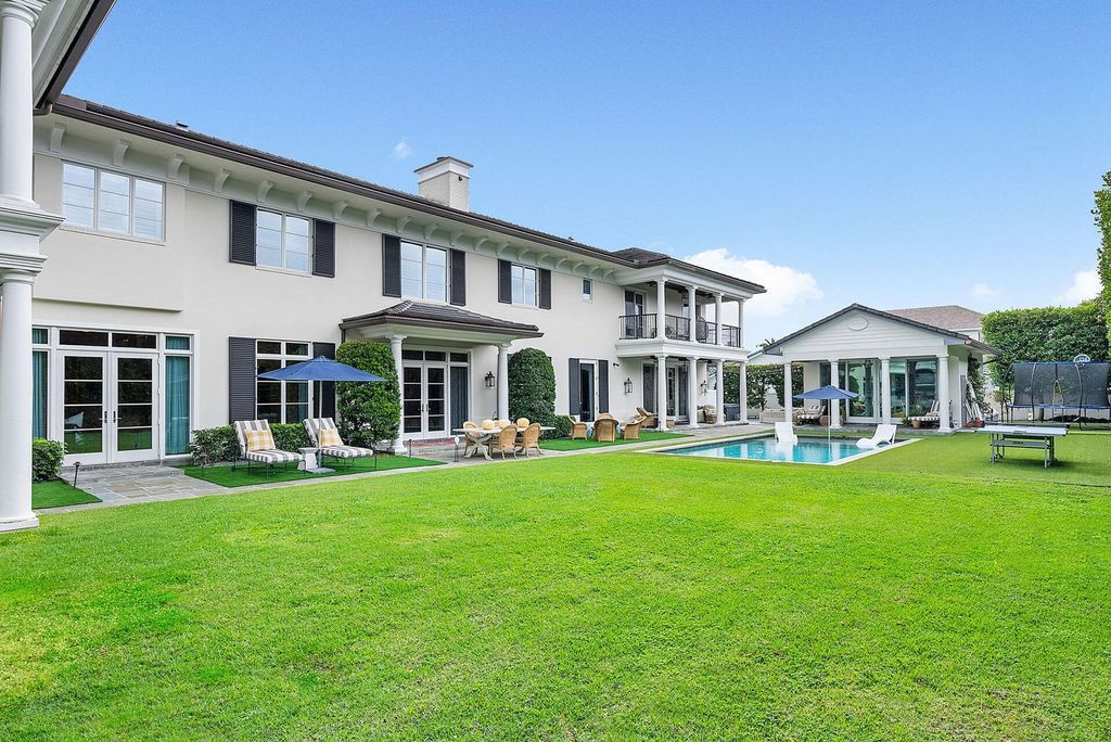 Live the epitome of luxury living in this 5-bedroom masterpiece by Tuthill Architecture in Boca Raton. Featuring a designer interior, pool, basketball court, putting green, casita, this estate offers the perfect blend of elegance and functionality.