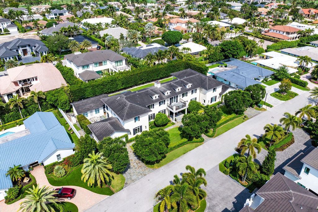 Live the epitome of luxury living in this 5-bedroom masterpiece by Tuthill Architecture in Boca Raton. Featuring a designer interior, pool, basketball court, putting green, casita, this estate offers the perfect blend of elegance and functionality.