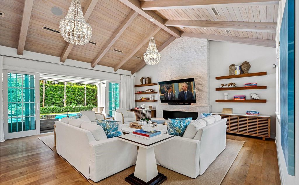 This stunning 4-bedroom estate boasts designer interiors, a sparkling pool and spa, and deeded beach club access.