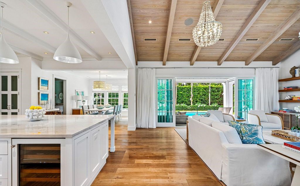 This stunning 4-bedroom estate boasts designer interiors, a sparkling pool and spa, and deeded beach club access.