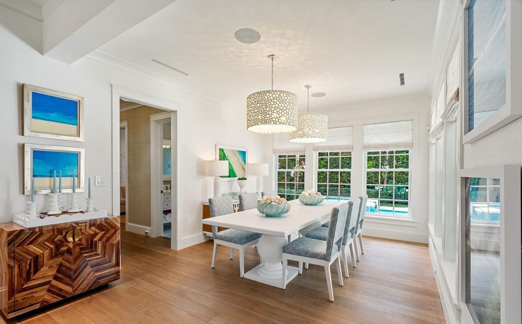 This stunning 4-bedroom estate boasts designer interiors, a sparkling pool and spa, and deeded beach club access.