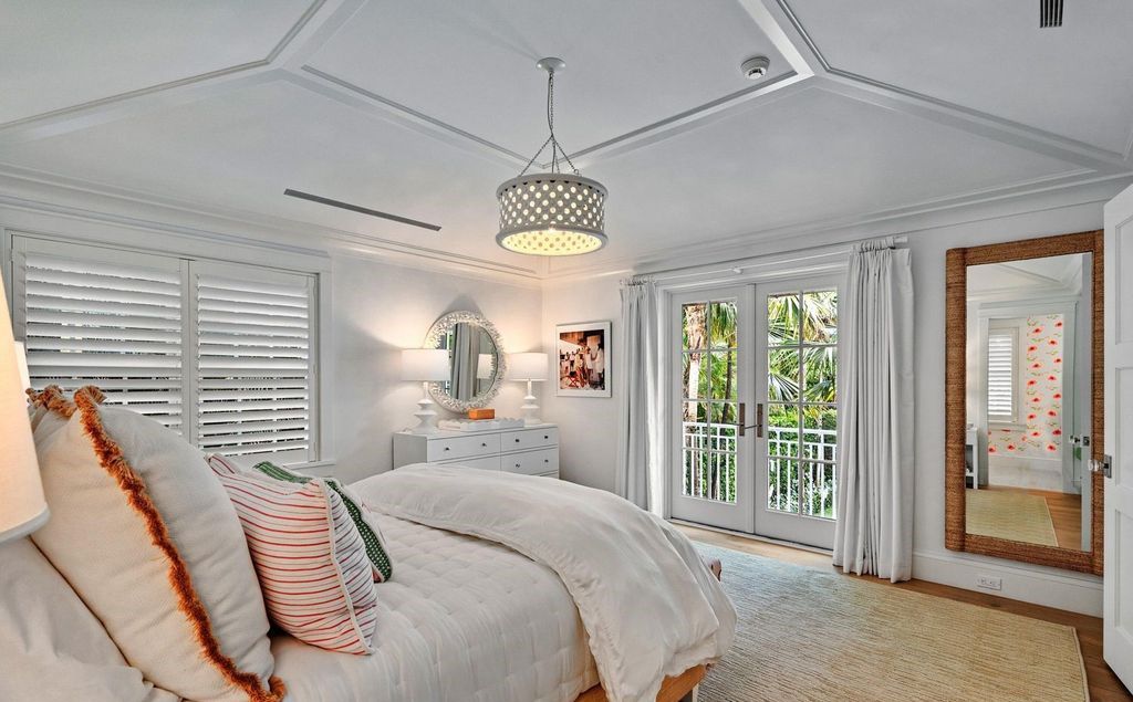 This stunning 4-bedroom estate boasts designer interiors, a sparkling pool and spa, and deeded beach club access.