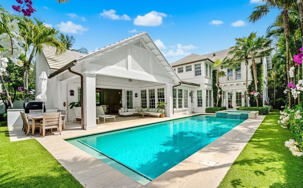 This stunning 4-bedroom estate boasts designer interiors, a sparkling pool and spa, and deeded beach club access.