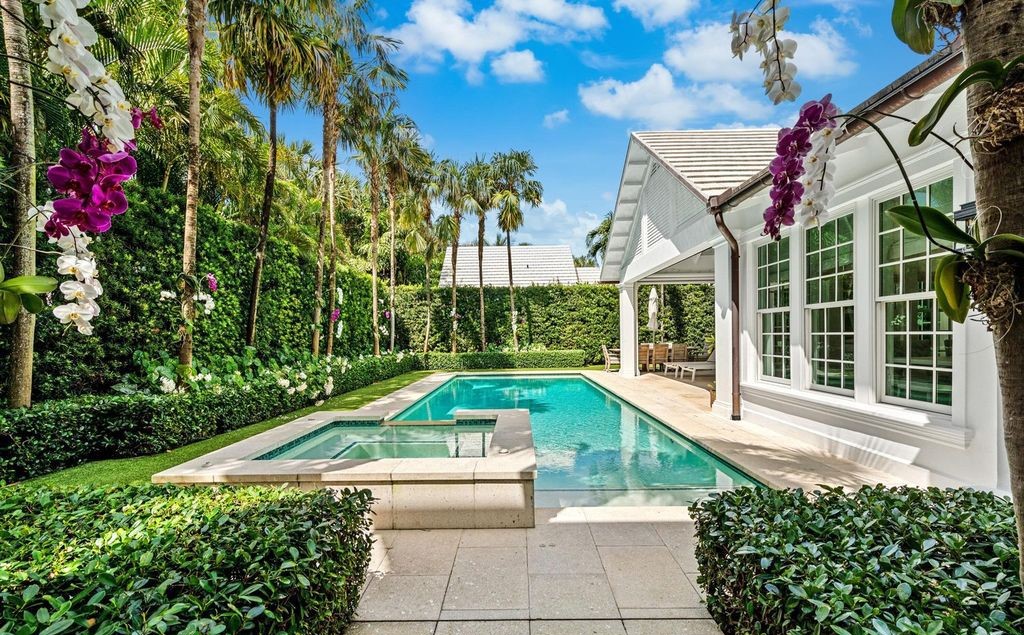 This stunning 4-bedroom estate boasts designer interiors, a sparkling pool and spa, and deeded beach club access.