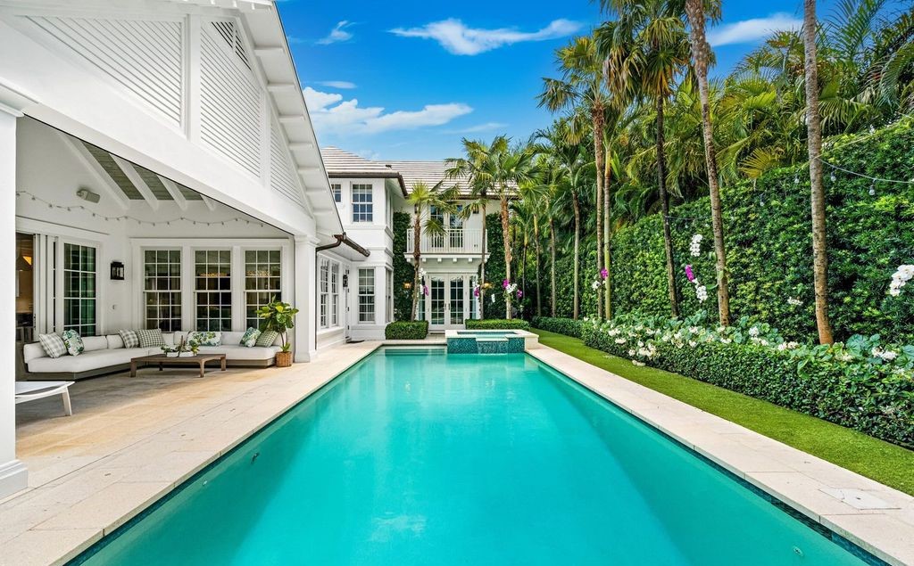 This stunning 4-bedroom estate boasts designer interiors, a sparkling pool and spa, and deeded beach club access.