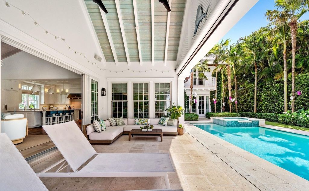 This stunning 4-bedroom estate boasts designer interiors, a sparkling pool and spa, and deeded beach club access.