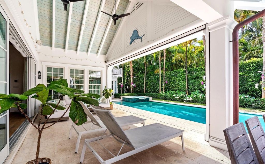 This stunning 4-bedroom estate boasts designer interiors, a sparkling pool and spa, and deeded beach club access.