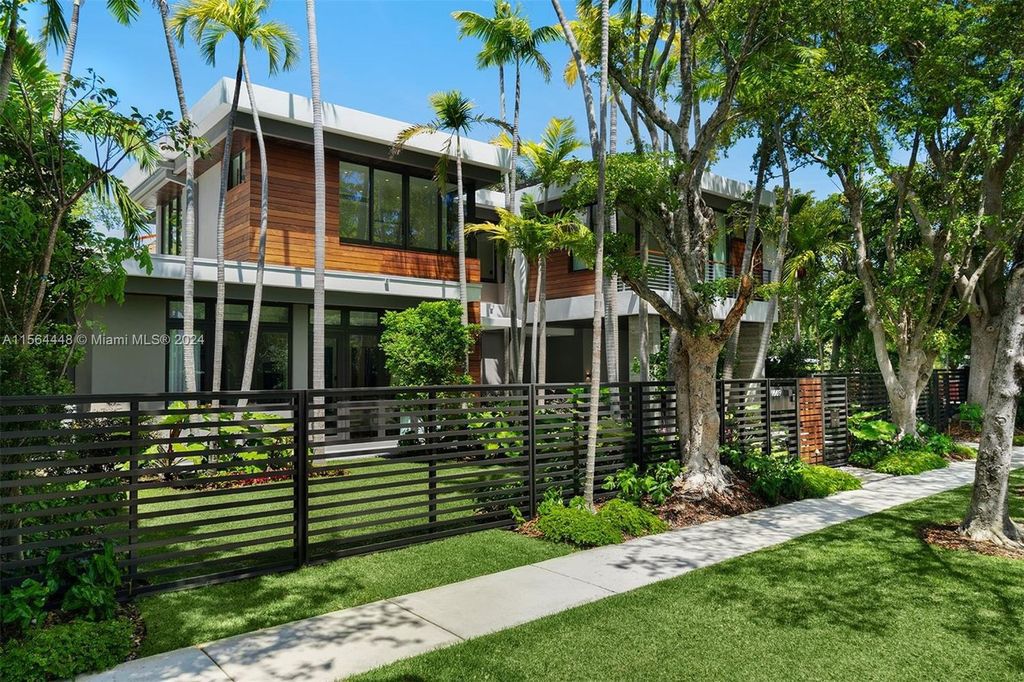 Designed by renowned architect Charles Treister, this 6-bedroom, 7-bathroom estate offers 7,146 square feet of luxurious living on a serene street in North Coconut Grove.