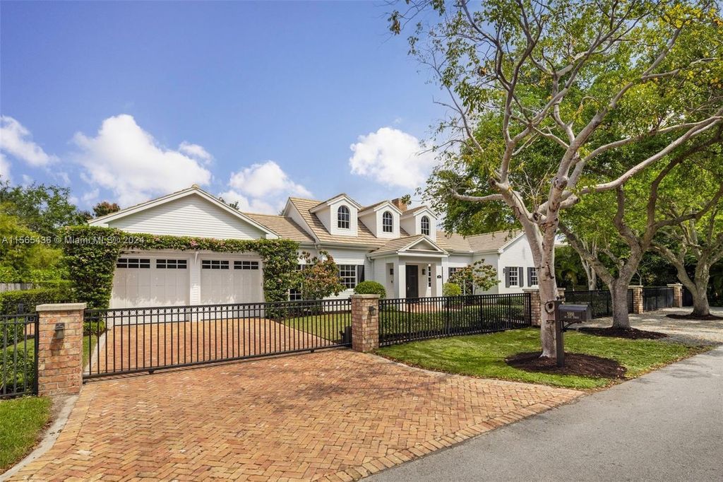 This Hamptons-inspired masterpiece boasts an expansive floor plan, gourmet kitchen with top-of-the-line appliances, and a spa-like primary suite.