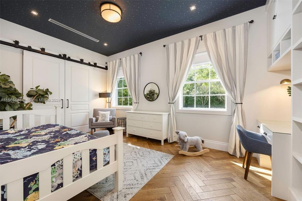 This Hamptons-inspired masterpiece boasts an expansive floor plan, gourmet kitchen with top-of-the-line appliances, and a spa-like primary suite.