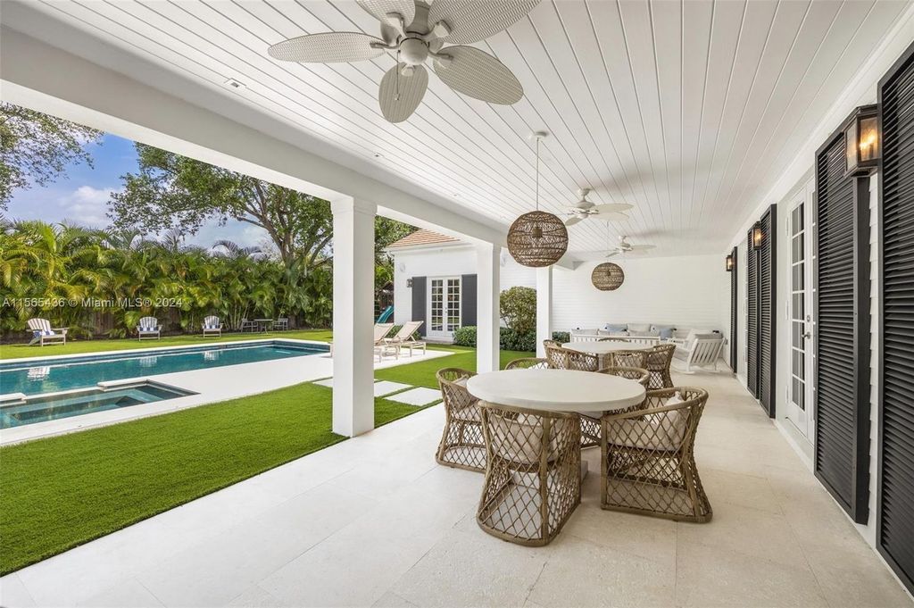 This Hamptons-inspired masterpiece boasts an expansive floor plan, gourmet kitchen with top-of-the-line appliances, and a spa-like primary suite.