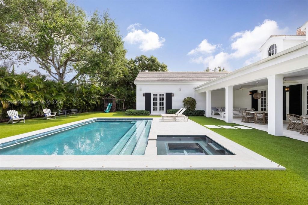 This Hamptons-inspired masterpiece boasts an expansive floor plan, gourmet kitchen with top-of-the-line appliances, and a spa-like primary suite.