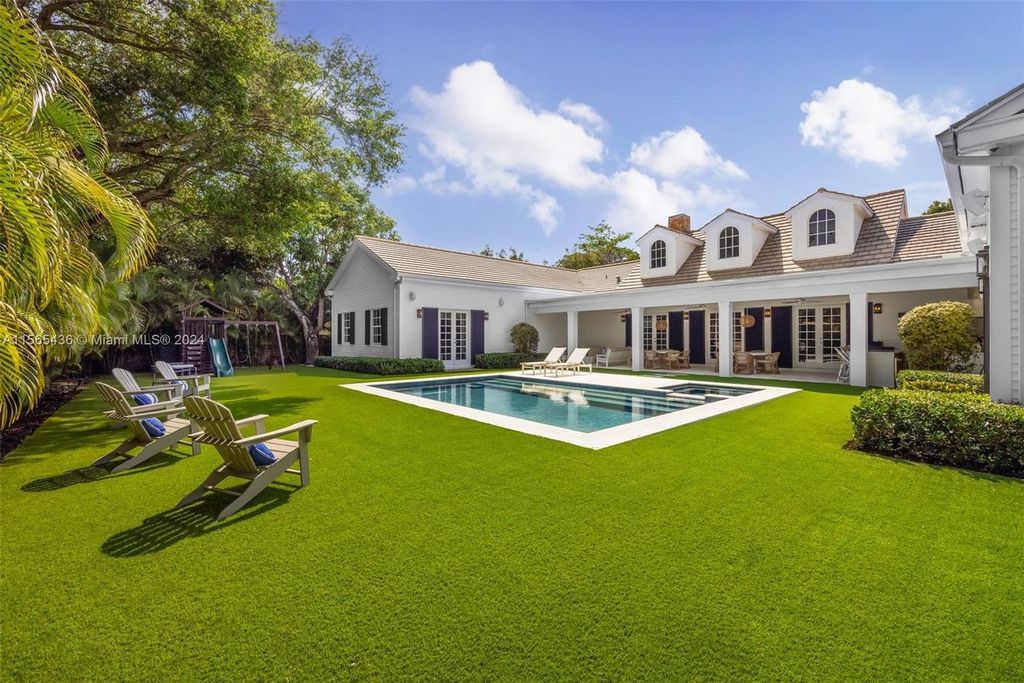 This Hamptons-inspired masterpiece boasts an expansive floor plan, gourmet kitchen with top-of-the-line appliances, and a spa-like primary suite.