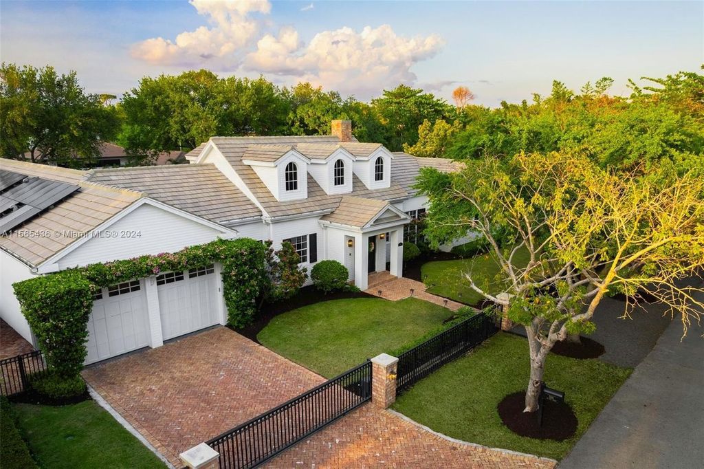 This Hamptons-inspired masterpiece boasts an expansive floor plan, gourmet kitchen with top-of-the-line appliances, and a spa-like primary suite.