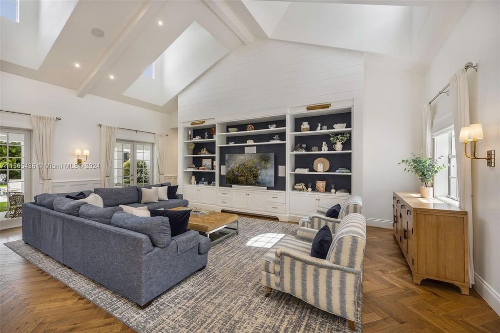 This Hamptons-inspired masterpiece boasts an expansive floor plan, gourmet kitchen with top-of-the-line appliances, and a spa-like primary suite.