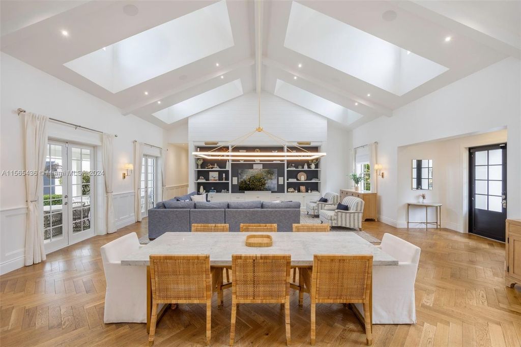 This Hamptons-inspired masterpiece boasts an expansive floor plan, gourmet kitchen with top-of-the-line appliances, and a spa-like primary suite.