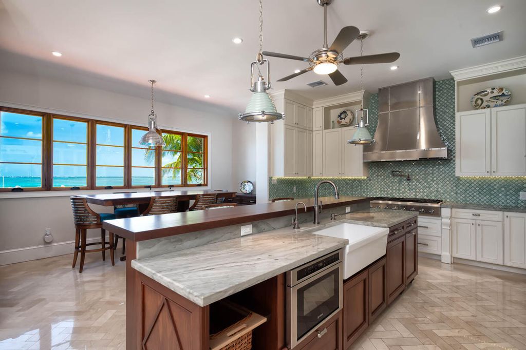 Escape to paradise in this stunning Key Colony Beach estate! Featuring an in-ground pool, private beach, and sprawling dock, this home offers unparalleled Florida Keys living. Enjoy ocean views, a chef's kitchen, and luxurious primary suite. Call today!